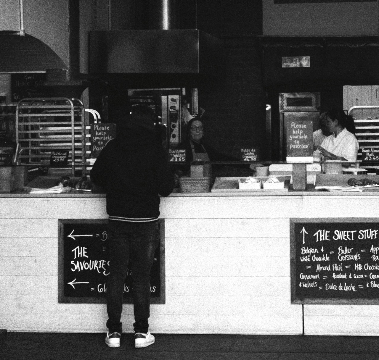 Pastry counter with baker behind